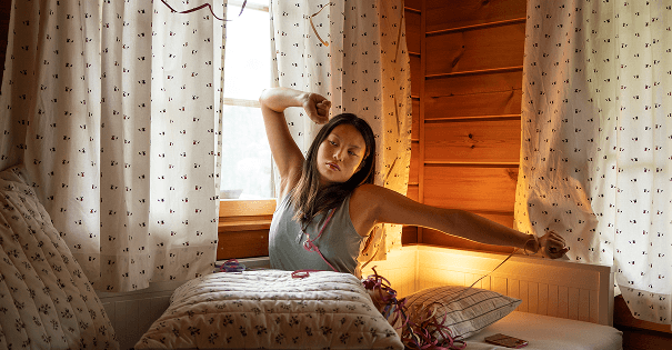 Person stretching in a cozy room